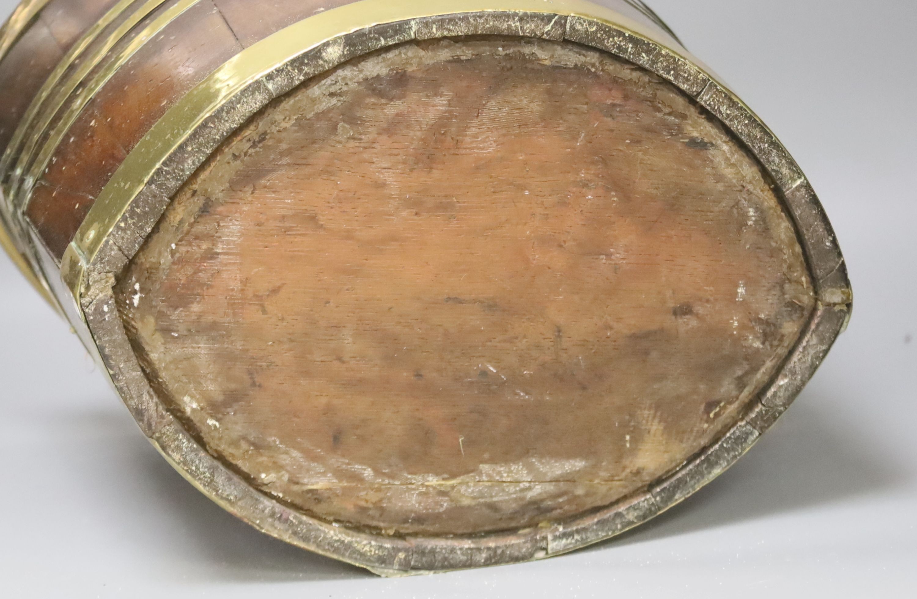 An early 19th century Dutch mahogany and brass bound oyster or peat bucket 33cm